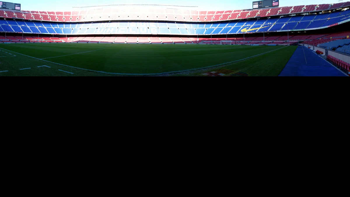 Panoramic view of the tiered stands of Camp Nou, FC Barcelona's stadium, in late-afternoon light
